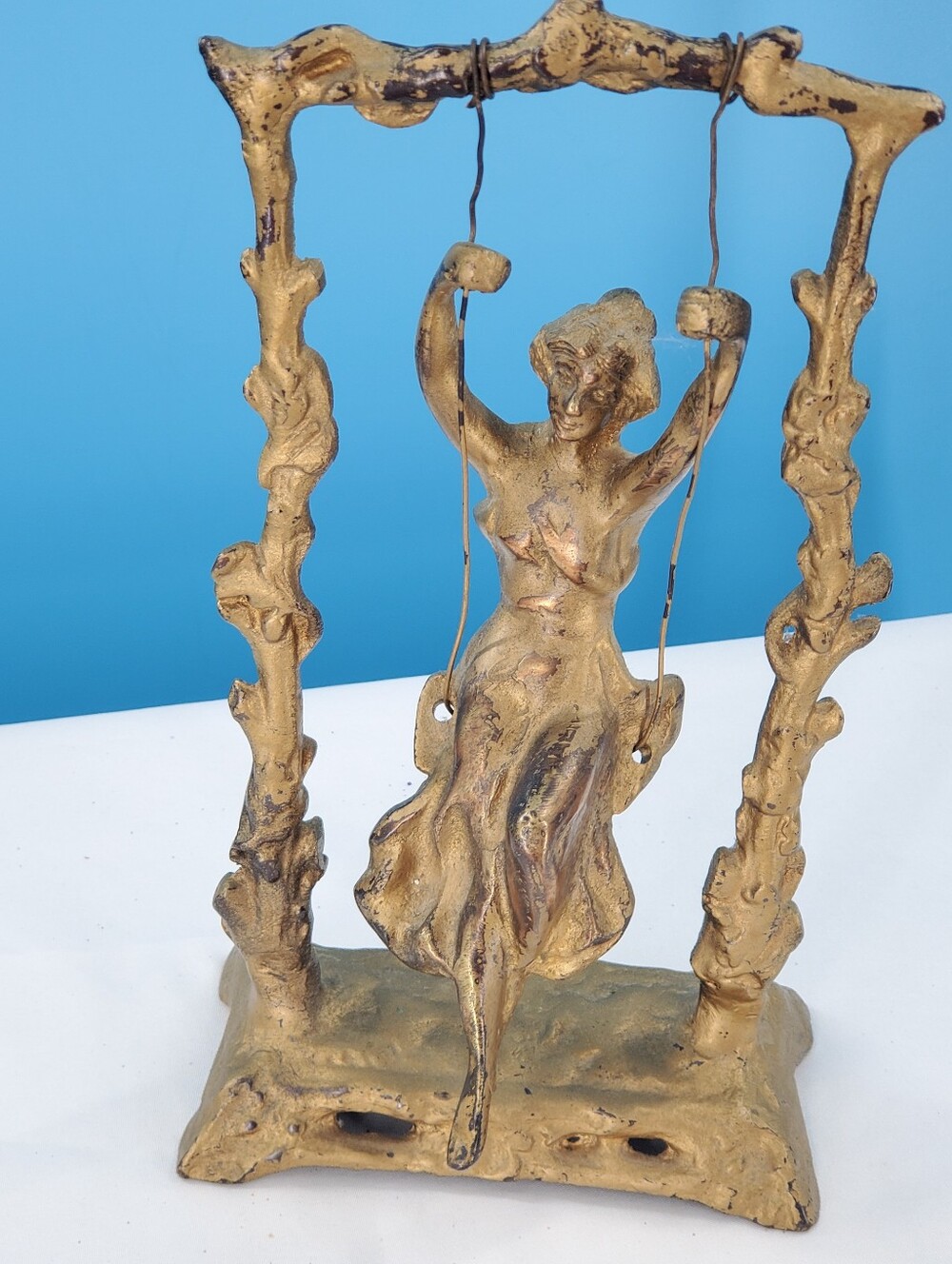 Hollywood regency brass sculpture "Girl on Swing"